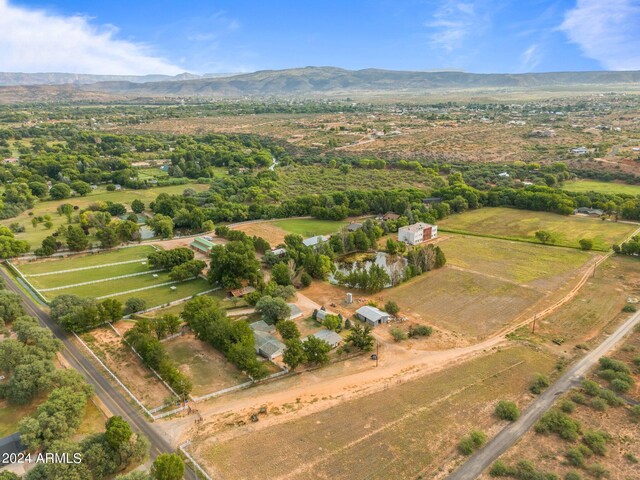 bird's eye view with a water and mountain view