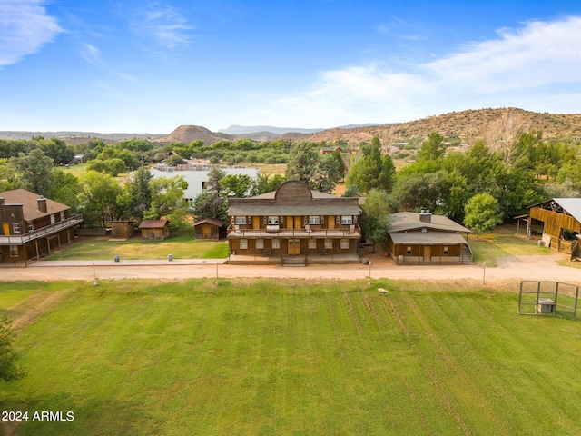 back of property featuring a mountain view