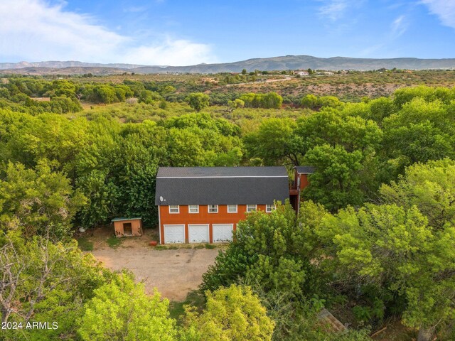 drone / aerial view with a mountain view and a rural view