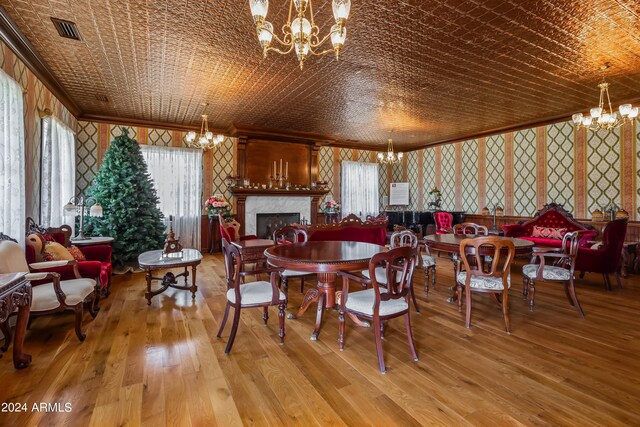 dining space featuring a notable chandelier and hardwood / wood-style flooring