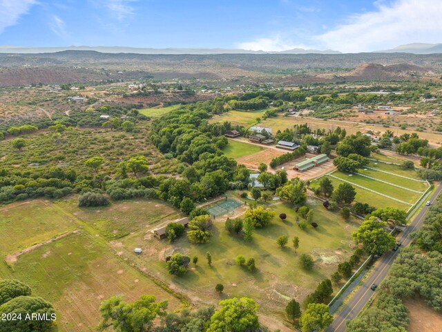 birds eye view of property with a mountain view and a rural view