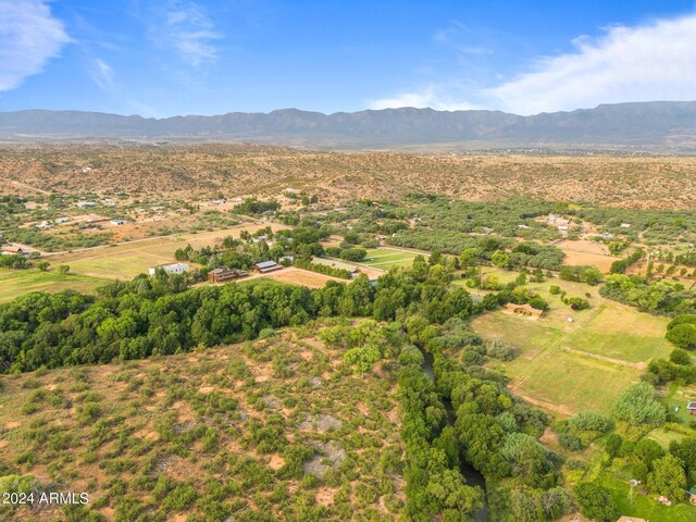 birds eye view of property with a mountain view