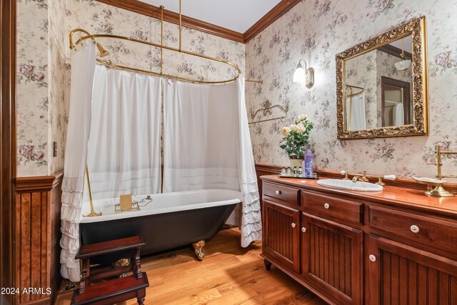 bedroom with light wood-type flooring and crown molding