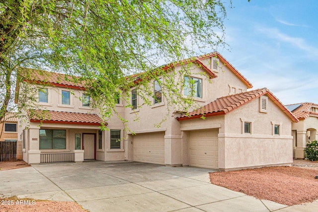 16215 W Durango St, Goodyear, AZ 85338 - mediterranean / spanish-style house featuring a tiled roof, stucco siding, and an attached garage