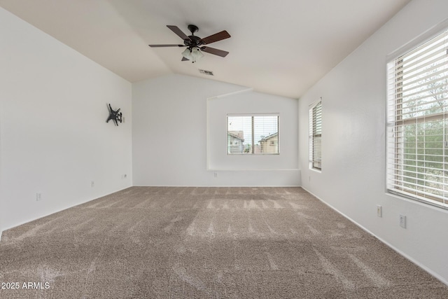 16215 W Durango St, Goodyear, AZ 85338 - empty room featuring carpet floors, ceiling fan, and vaulted ceiling