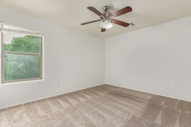 16215 W Durango St, Goodyear, AZ 85338 - empty room featuring carpet, a ceiling fan, and baseboards