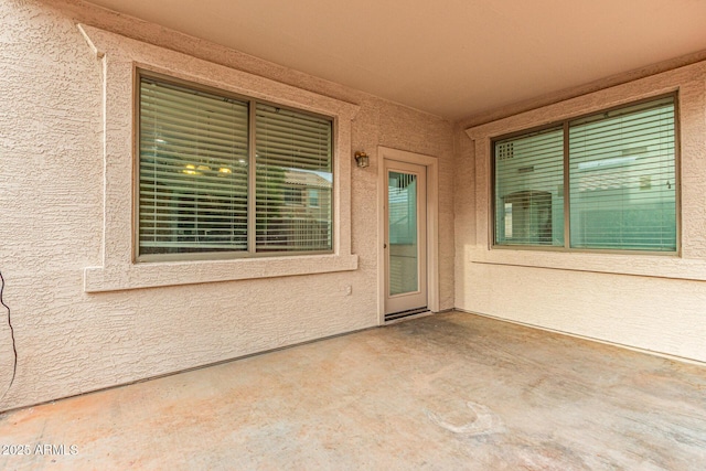 16215 W Durango St, Goodyear, AZ 85338 - doorway to property with a patio and stucco siding