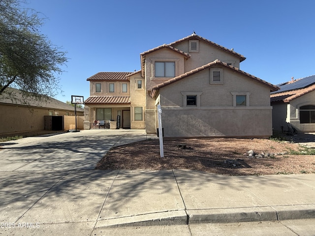 16215 W Durango St, Goodyear, AZ 85338 - rear view of property with a tiled roof, stucco siding, and driveway