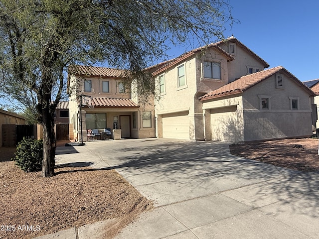 16215 W Durango St, Goodyear, AZ 85338 - view of front of house featuring a tiled roof, driveway, a garage, and stucco siding
