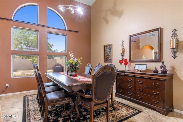 5212 S Monte Vista St, Chandler, AZ 85249 - dining space featuring light tile patterned floors, baseboards, and a towering ceiling
