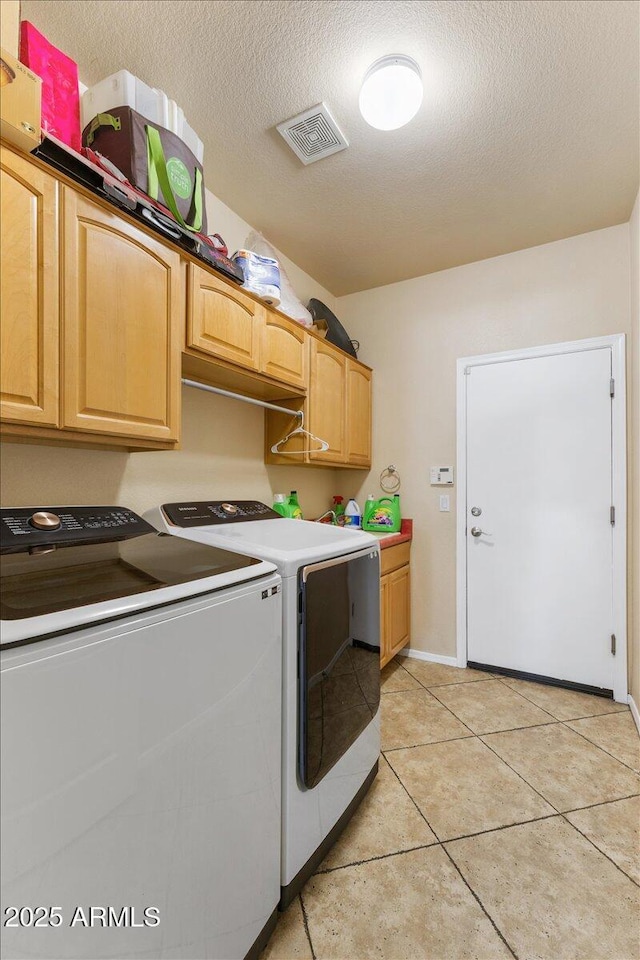 5212 S Monte Vista St, Chandler, AZ 85249 - laundry room with washer and dryer, cabinet space, light tile patterned floors, a textured ceiling, and baseboards