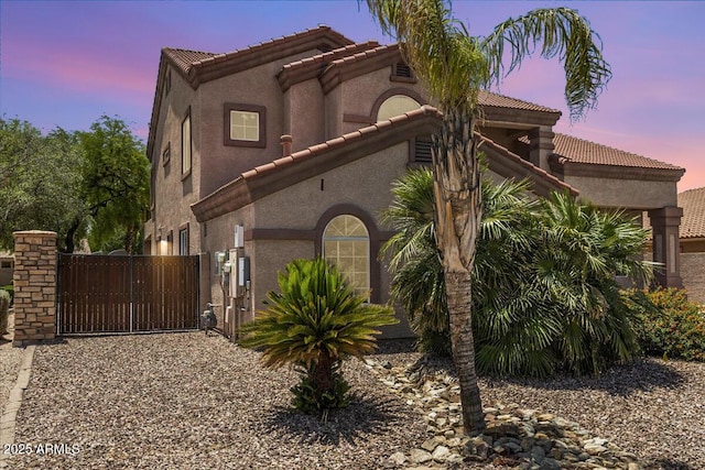 5212 S Monte Vista St, Chandler, AZ 85249 - view of front of property with a tile roof, a gate, and stucco siding