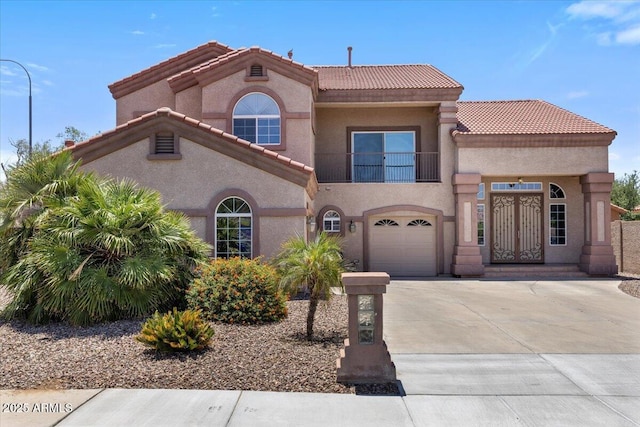5212 S Monte Vista St, Chandler, AZ 85249 - mediterranean / spanish house featuring a balcony, driveway, a tile roof, stucco siding, and a garage