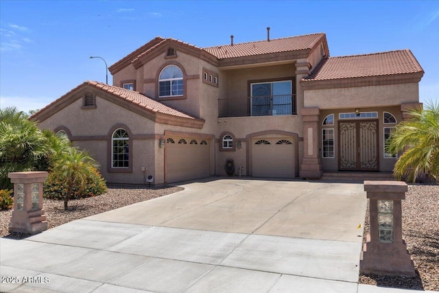 5212 S Monte Vista St, Chandler, AZ 85249 - mediterranean / spanish house with a tile roof, stucco siding, driveway, a garage, and a balcony