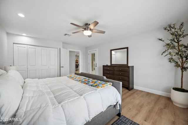 bedroom featuring visible vents, a closet, baseboards, recessed lighting, and light wood finished floors