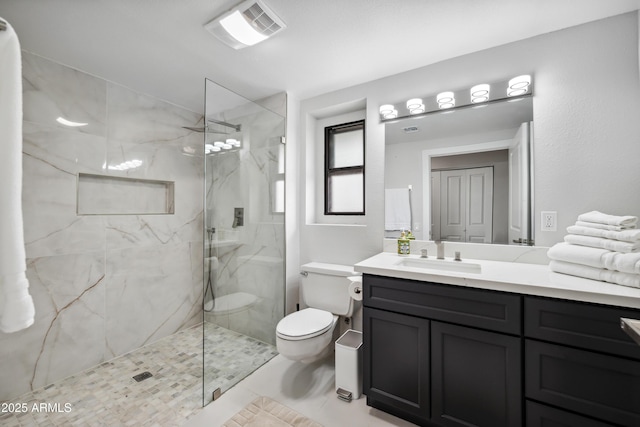 full bathroom featuring visible vents, tile patterned flooring, vanity, toilet, and a marble finish shower