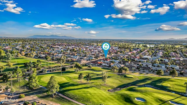 aerial view featuring a residential view, a mountain view, and golf course view