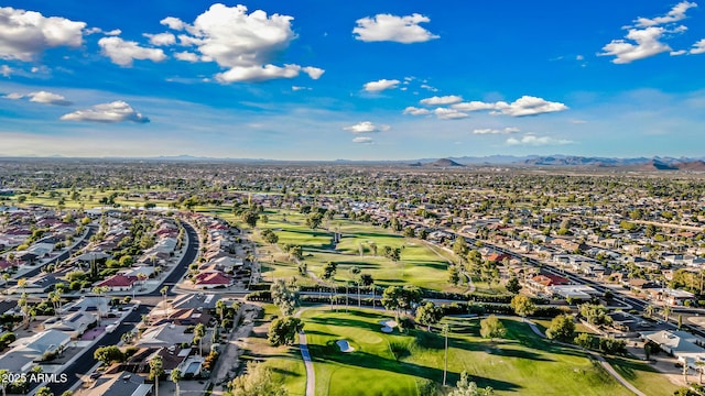 aerial view featuring a residential view, a mountain view, and golf course view