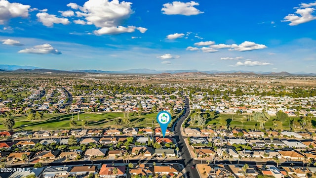 aerial view with a residential view, a mountain view, and view of golf course