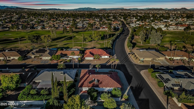 birds eye view of property featuring a residential view, a mountain view, and view of golf course