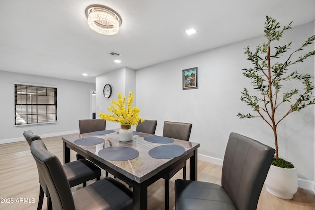 dining room featuring recessed lighting, baseboards, light wood finished floors, and visible vents
