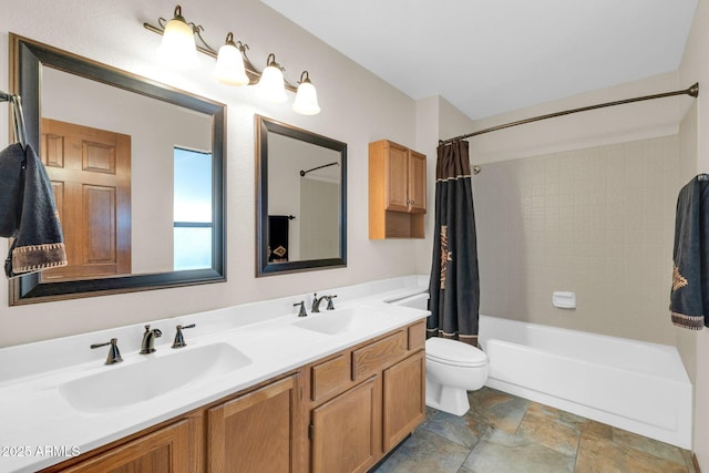 full bath featuring double vanity, toilet, shower / bath combo, and a sink