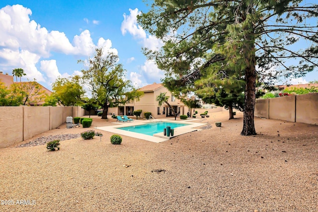 view of pool with a fenced in pool, a fenced backyard, and a patio area