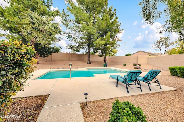 view of pool with a fenced in pool, a patio, and a fenced backyard