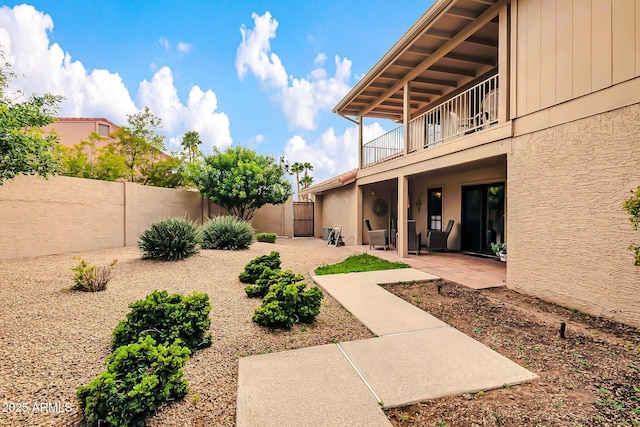 view of yard featuring a patio area and a fenced backyard