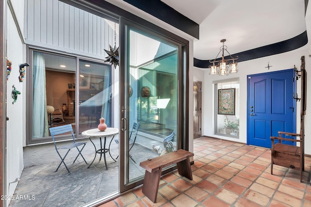 entrance foyer featuring a chandelier