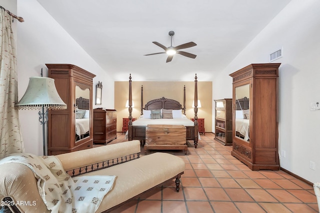 bedroom with ceiling fan, light tile patterned floors, and lofted ceiling