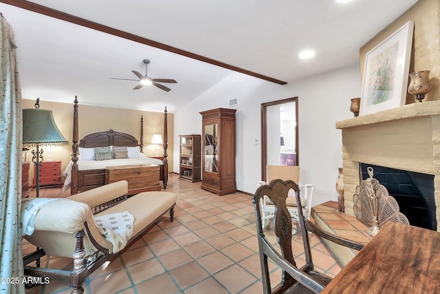 bedroom with vaulted ceiling, ceiling fan, and light tile patterned flooring