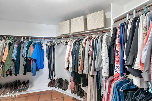 spacious closet with tile patterned floors