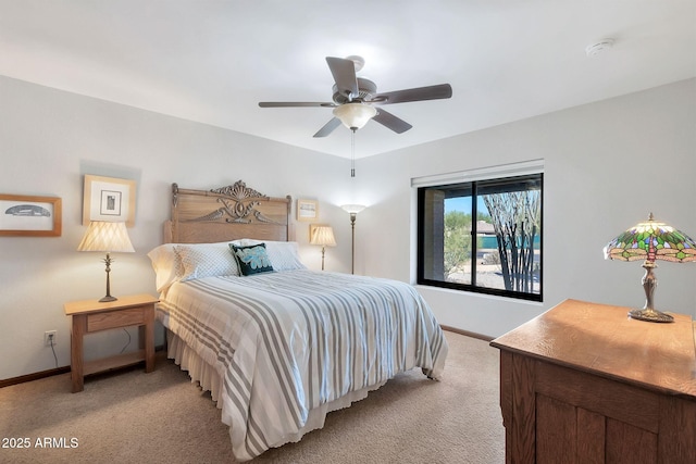 bedroom with light colored carpet and ceiling fan