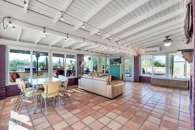 sunroom / solarium with ceiling fan, lofted ceiling with beams, an AC wall unit, and wood ceiling