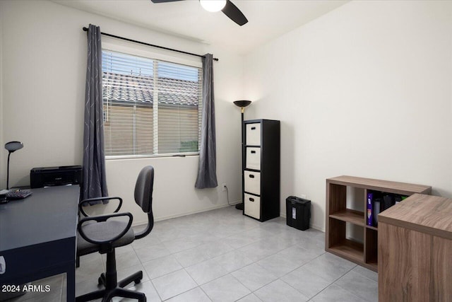 tiled home office featuring ceiling fan