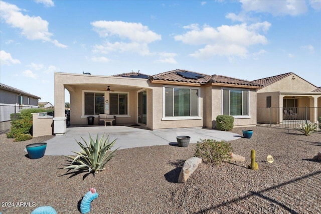 back of property with a patio and ceiling fan