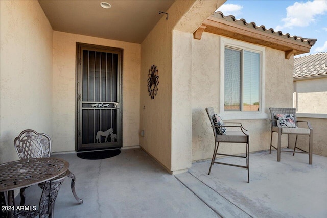 property entrance with a patio