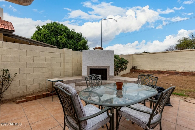 view of patio featuring outdoor dining space and a fenced backyard