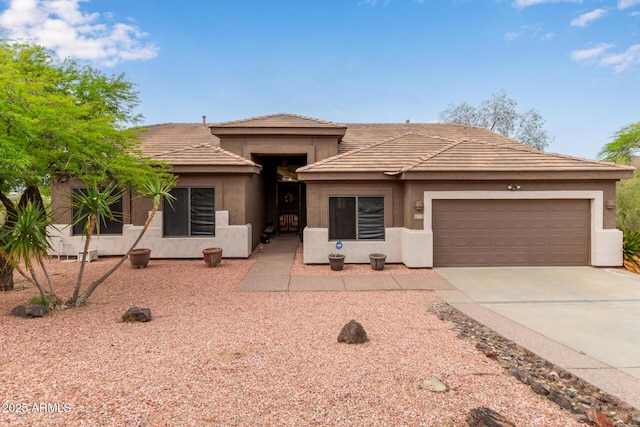 18 E Paint Your Wagon Trl, Phoenix, AZ 85085 - prairie-style house with a garage, stucco siding, and concrete driveway