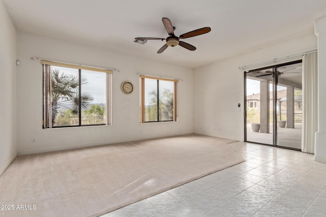 18 E Paint Your Wagon Trl, Phoenix, AZ 85085 - empty room with plenty of natural light, a ceiling fan, and light carpet
