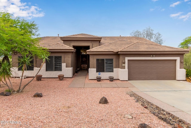 18 E Paint Your Wagon Trl, Phoenix, AZ 85085 - prairie-style house with a garage, stucco siding, and concrete driveway