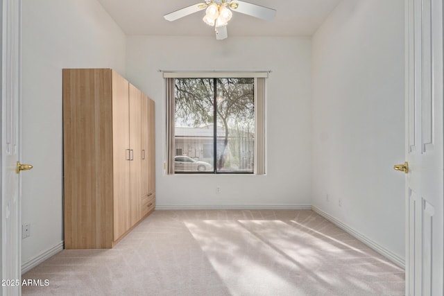 18 E Paint Your Wagon Trl, Phoenix, AZ 85085 - unfurnished bedroom with light colored carpet, baseboards, and a ceiling fan