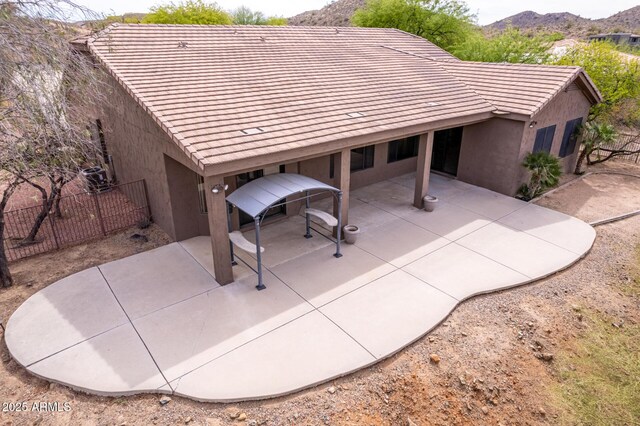 18 E Paint Your Wagon Trl, Phoenix, AZ 85085 - rear view of property with fence, a tile roof, stucco siding, a patio, and a mountain view