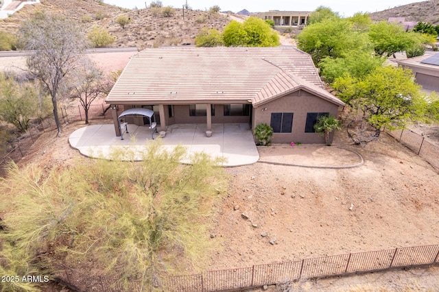 18 E Paint Your Wagon Trl, Phoenix, AZ 85085 - rear view of house with a patio area, a tiled roof, stucco siding, and fence