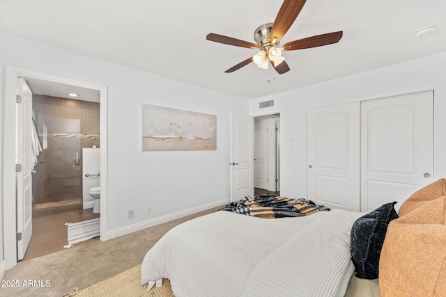 bedroom with light carpet, visible vents, baseboards, a closet, and ensuite bath