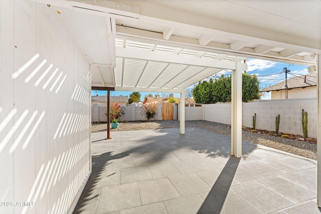 view of patio / terrace with a fenced backyard and a pergola