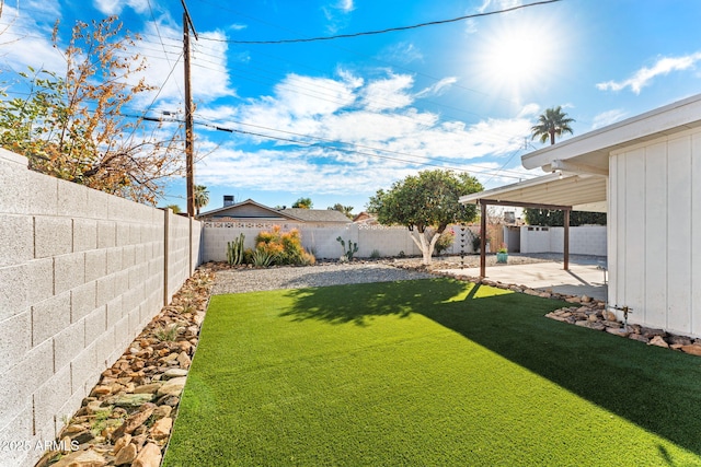 view of yard featuring a patio area and a fenced backyard