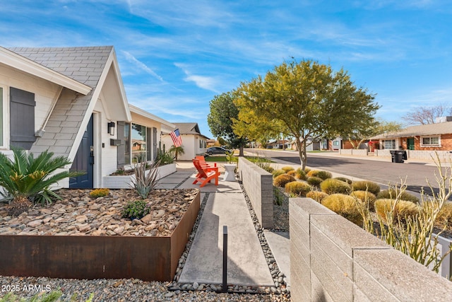 view of yard with a residential view and fence