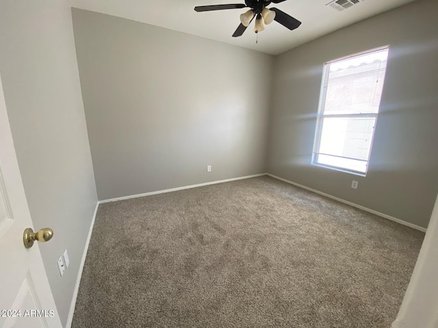 unfurnished room with carpet floors and ceiling fan